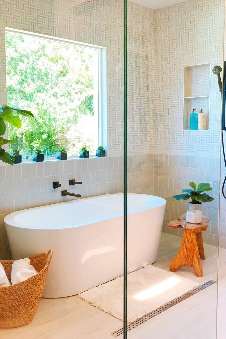 Modern bathroom with freestanding plant tub and shower area