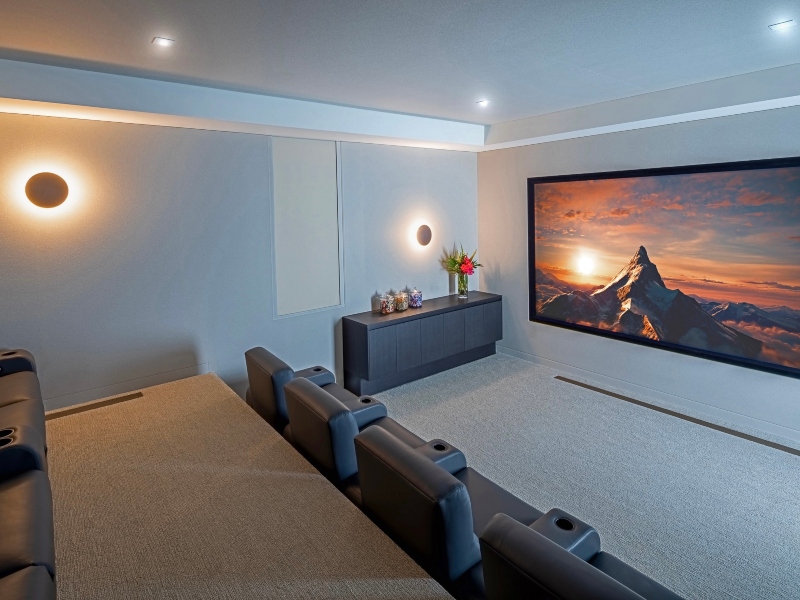 Rich, warm, cream-colored home theater in a luxurious living environment.