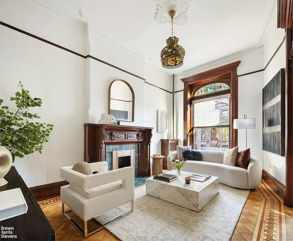 Bed Stuy – Living room with hardwood floors, mantel and stained glass