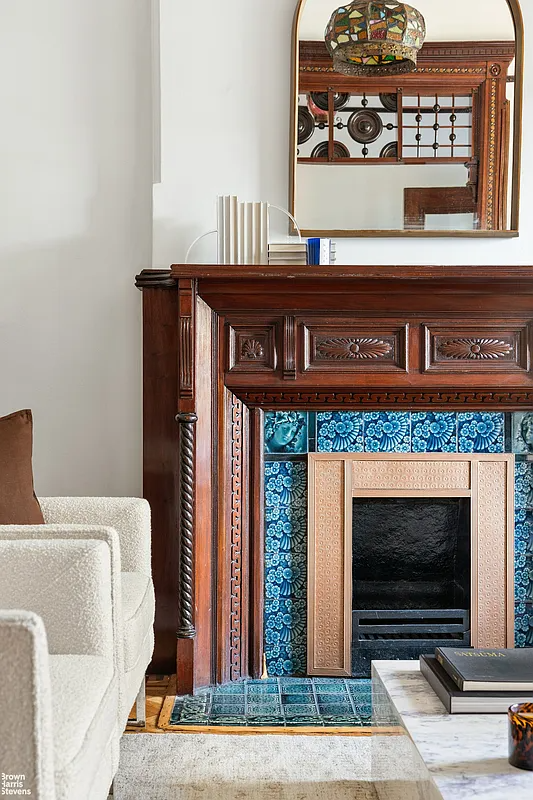 Detail of the mantelpiece in the drawing room with blue tile surround