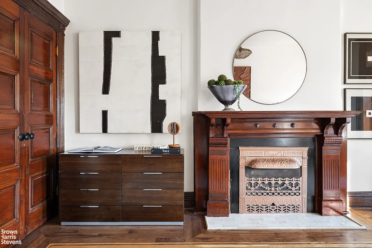 Wood burning fireplace in bedroom with modern tiled fireplace