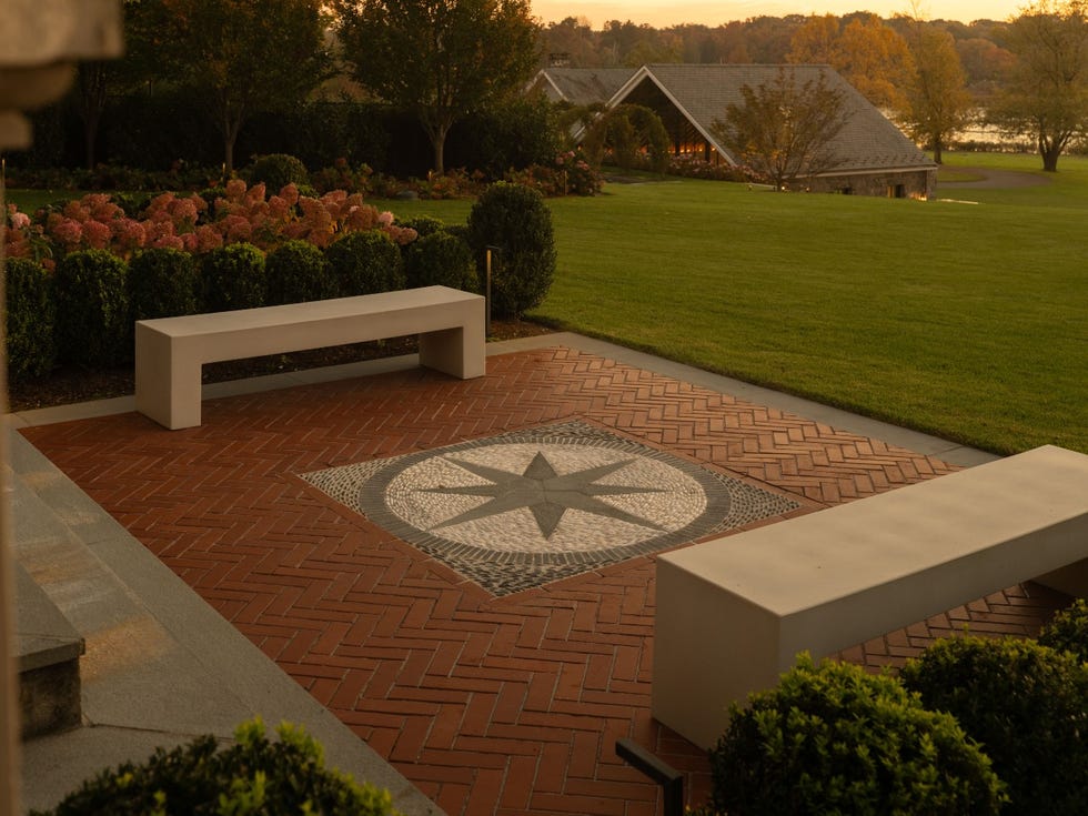 Outdoor patio with compass design and benches