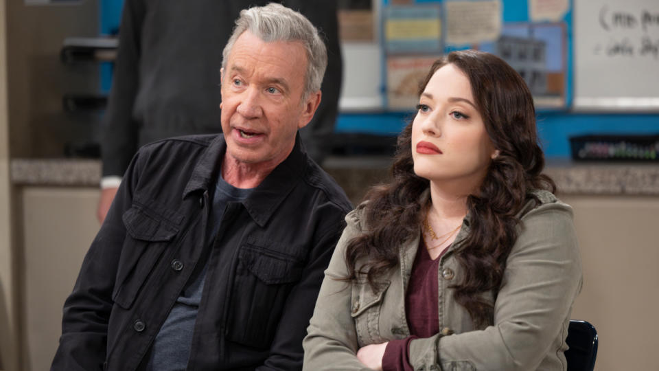 Tim Allen leans in to speak to Kat Dennings in a classroom in Shifting Gears S1 E2. 