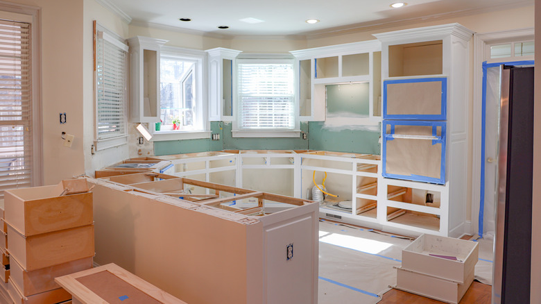 The interior of a kitchen is currently being renovated.