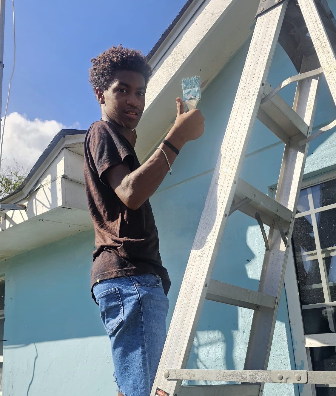 Boyz2men paint and repair homes to give back to the community