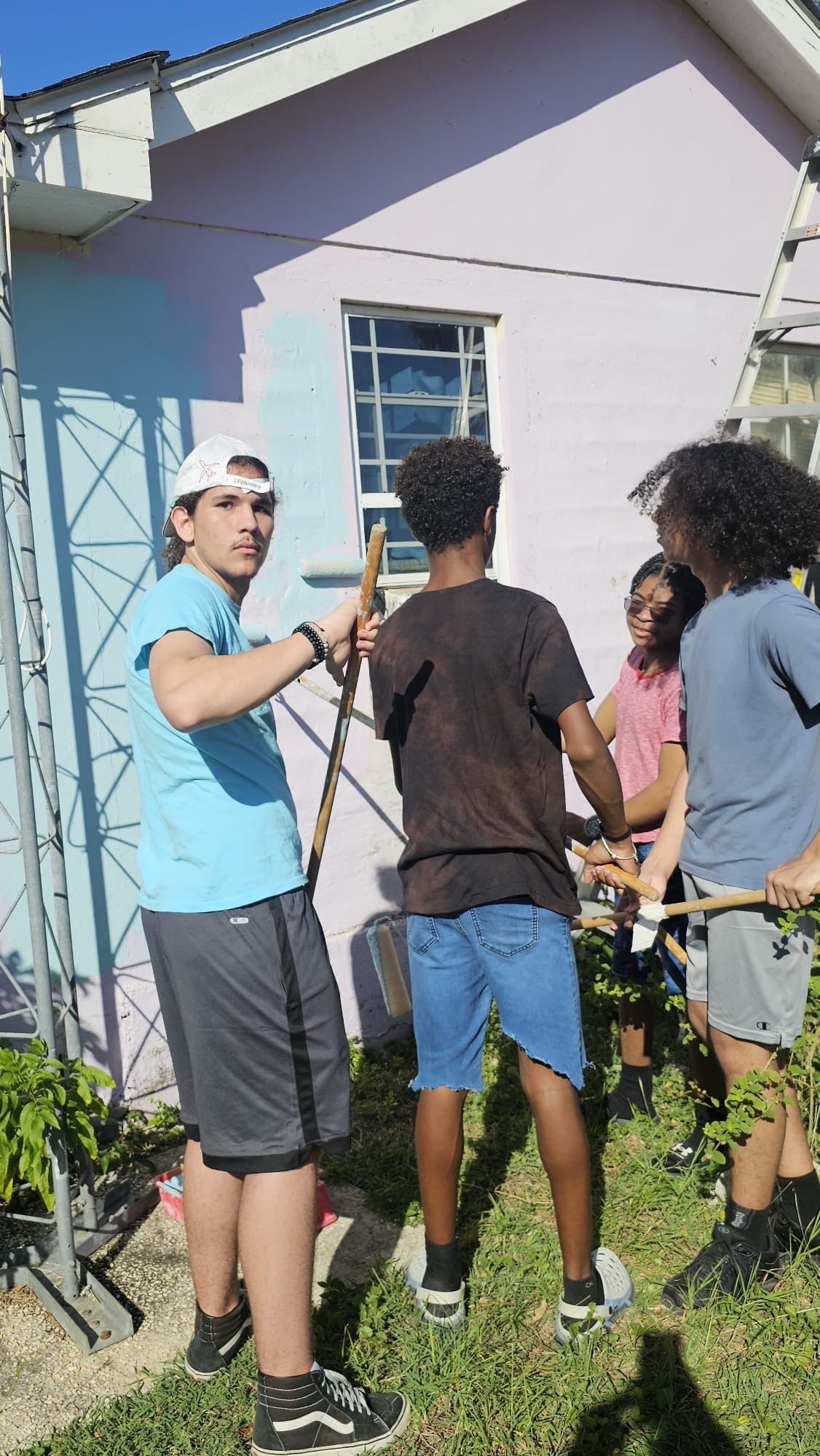 Boyz2men paint and repair homes to give back to the community