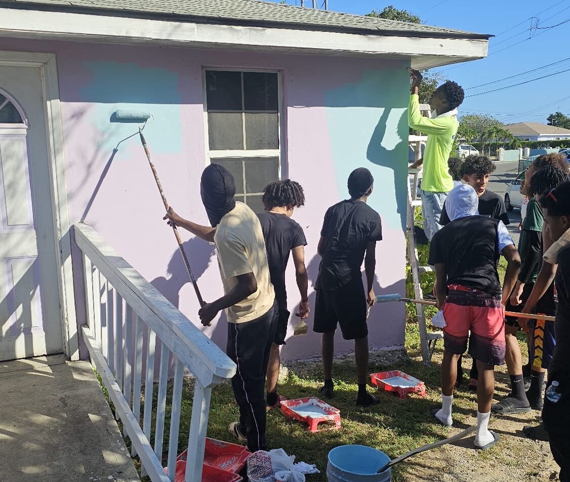 Boyz2men paint and repair homes to give back to the community