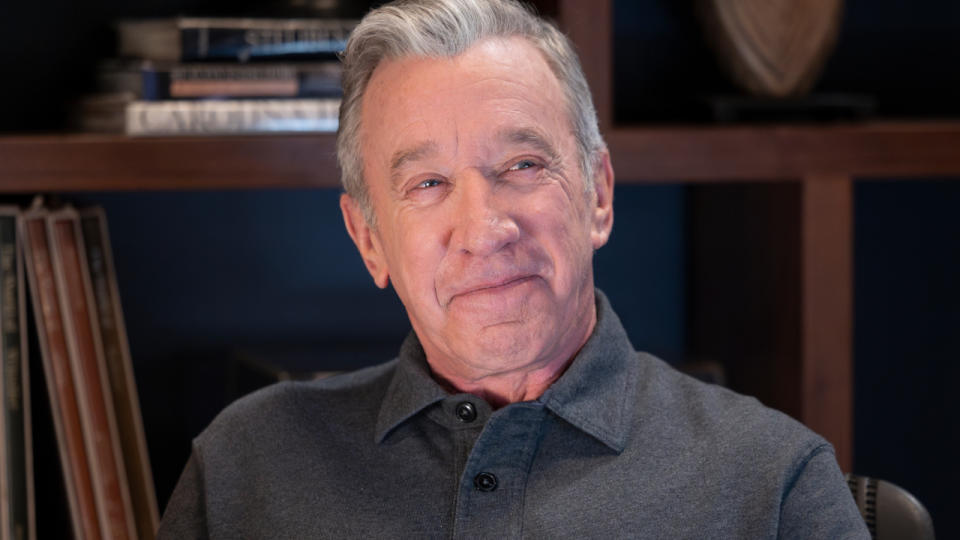     Tim Allen sits smiling in his office in Shifting Gears S1 E2, "Accommodations." . 