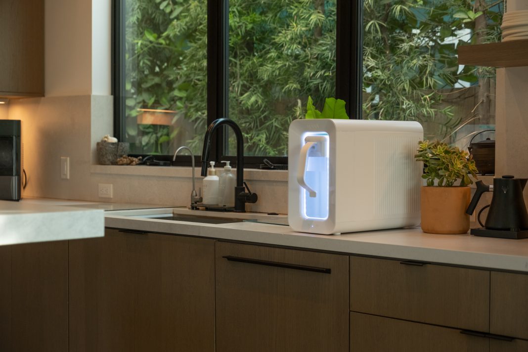 Spout atmospheric water generator on kitchen worktop