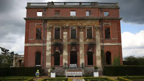 Getty Images Fire Brigade Officers Inspect the burned remains at Clandon Park House on April 30, 2015 near Guildford