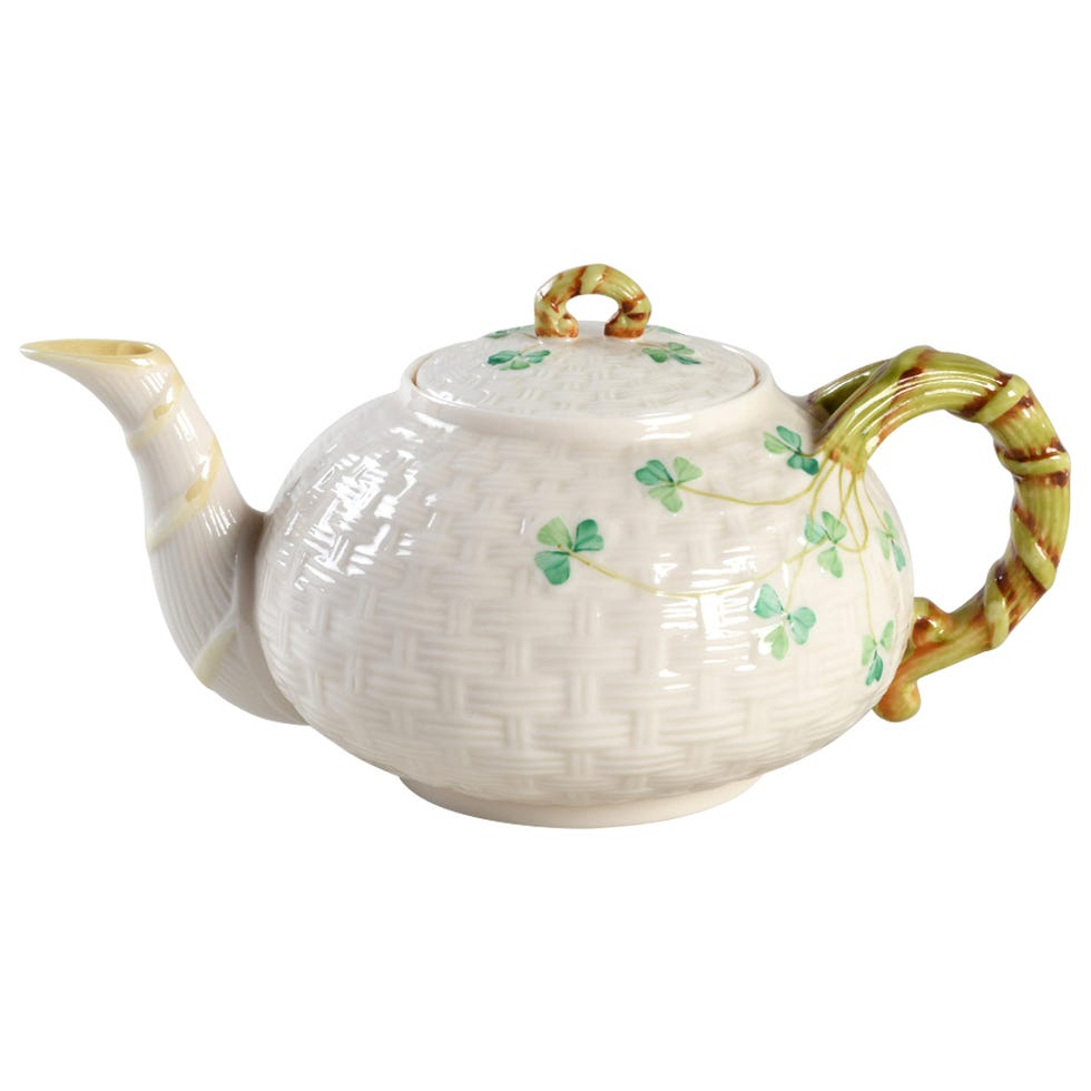 Teapot with a bamboo grip and clover designs