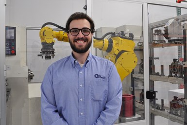 Headshot photo of the person in front of a robot