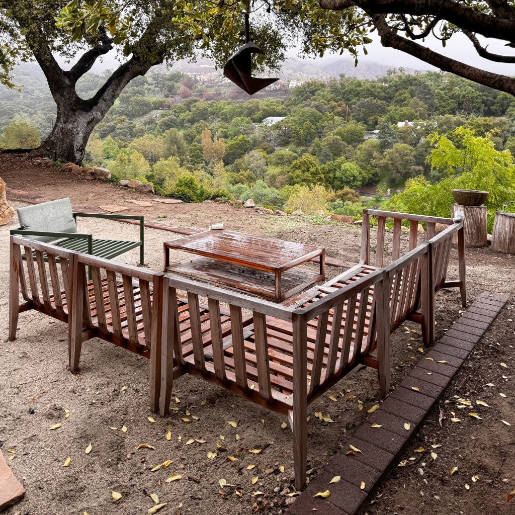 An external section section outdoors in a rainy outdoor environment with all its pillows.