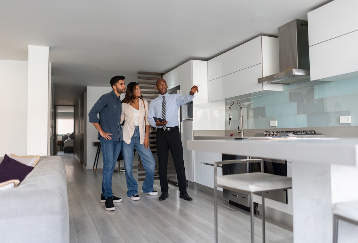 A real estate agent who sells converted kitchen to home buyers.
