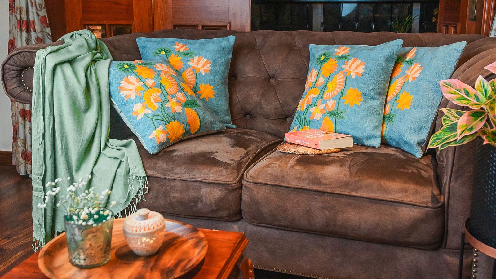 Image can contain Pushion Home Decor Couch Furnique Book Publication Pillow Desk and Table
