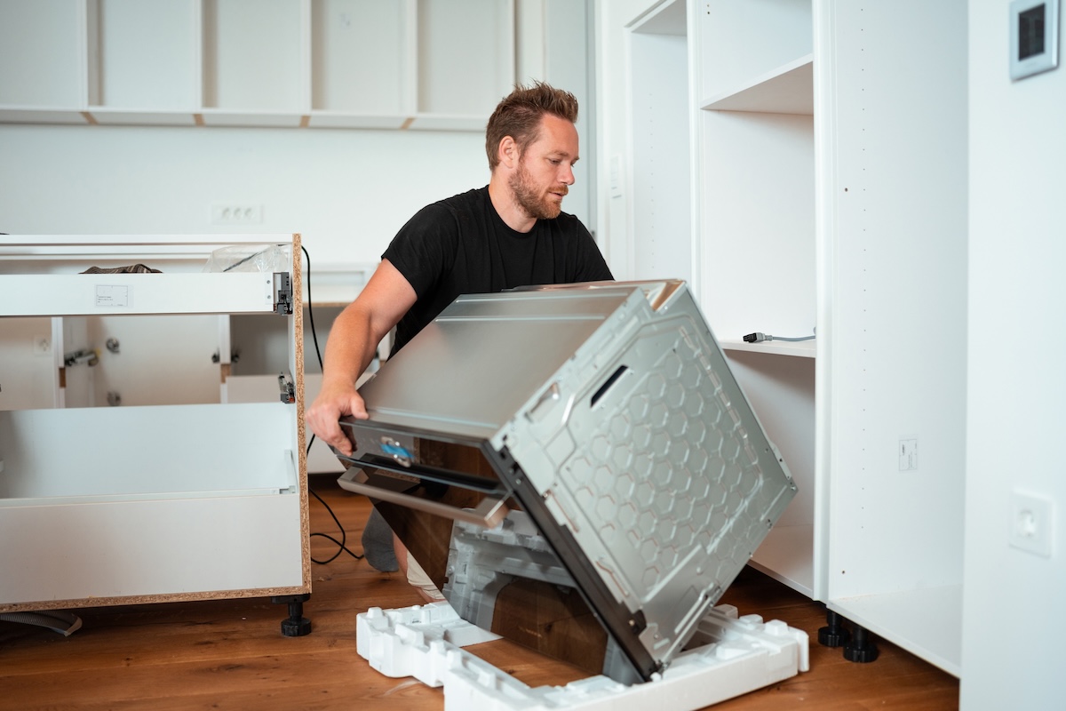 A homeowner who installs a new energy -efficient oven in a small kitchen conversion.