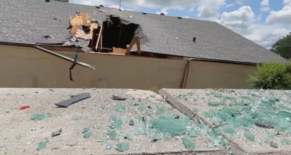 The car fell through the roof of the building.