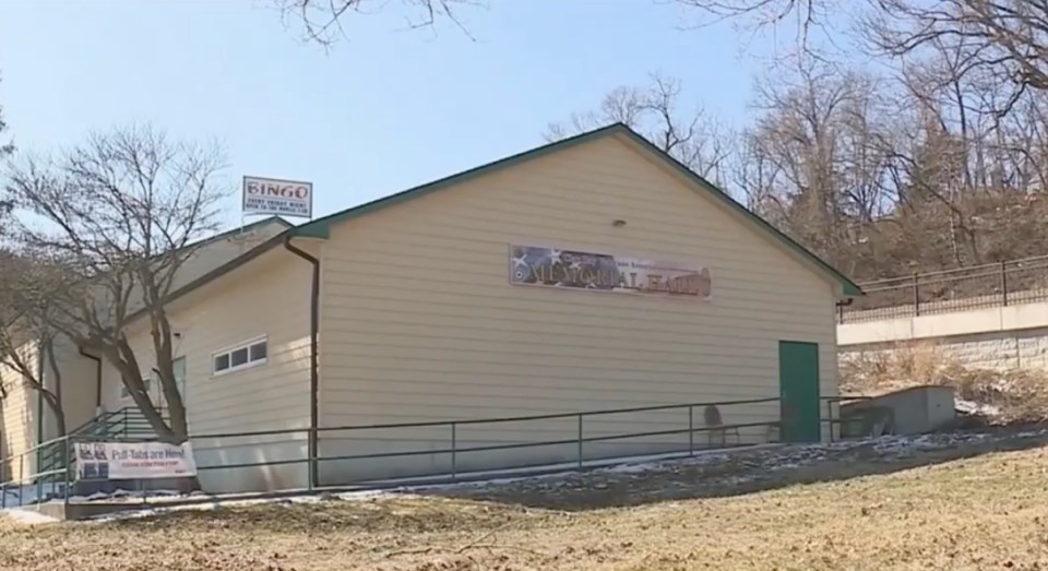 Screenshot of a news report about a car that crashes through the roof of a building.