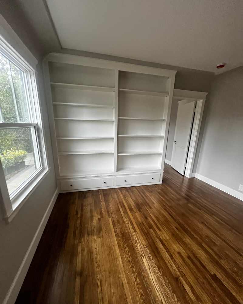 Empty built -in shelves in the home office before the staging at home.