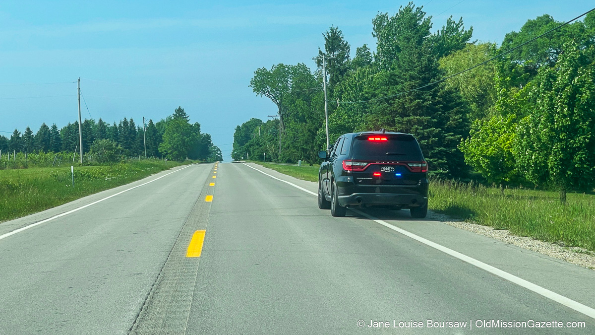 The police officer pulls Speeder on the Center Road north of the Old Mission Road at the old Mission Peninsula | Jane Boursaw Photo
