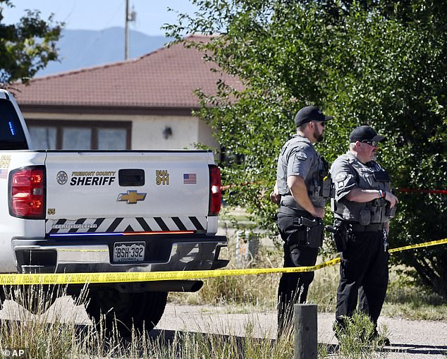 The members of Fremont County guard the street, which leads to return to the funeral home in Penrose, Colorado, in October 2023