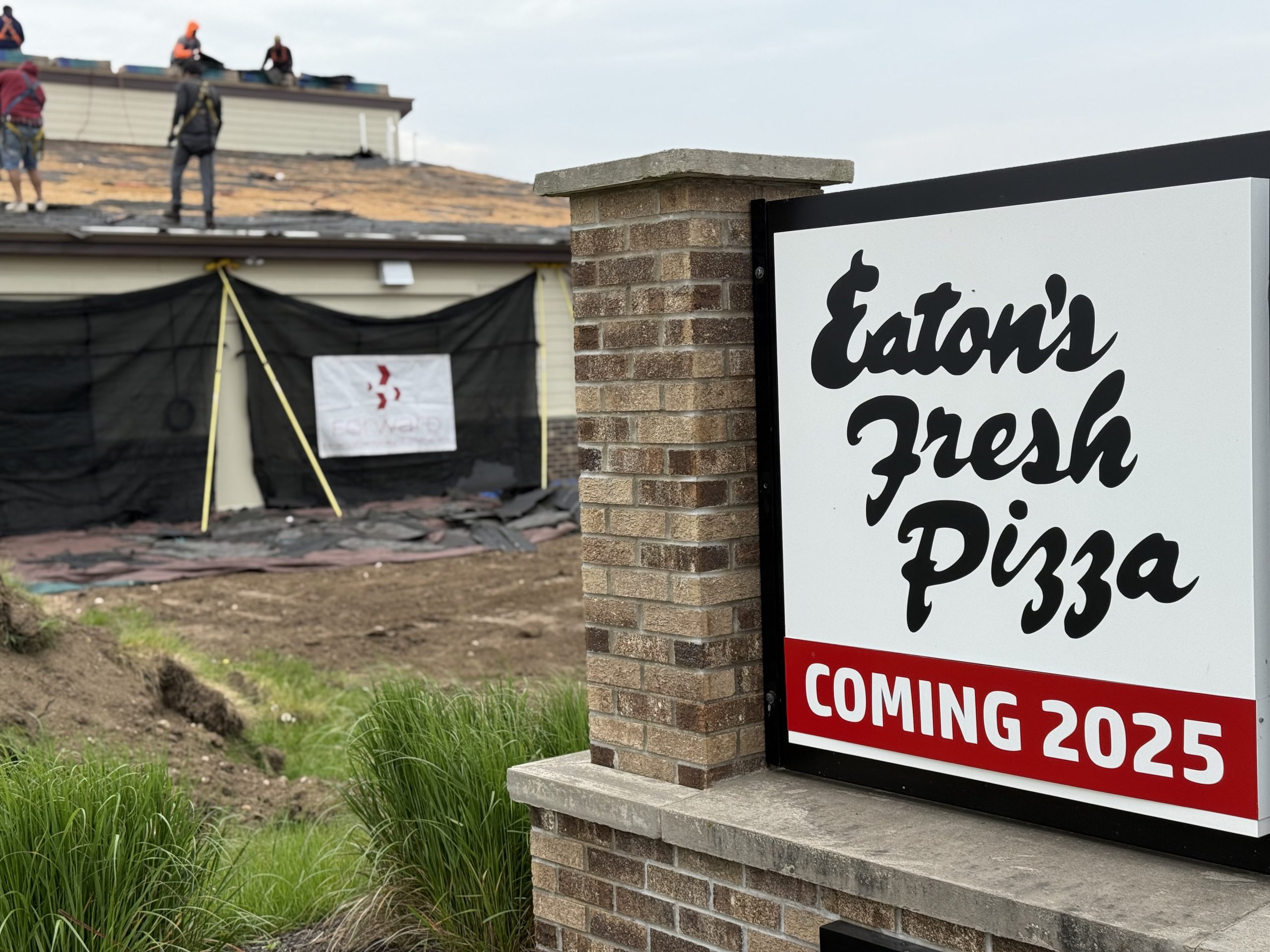 Real estate | Video | Forward Remodeling brings new roof to Eaton's fresh pizza in the River Road in West Bend, Wi