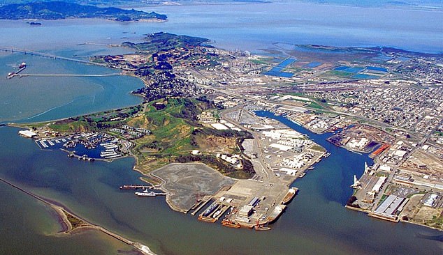 Image: an overhead view of Richmond, California. The village of Atchison is the residential area in the middle right side