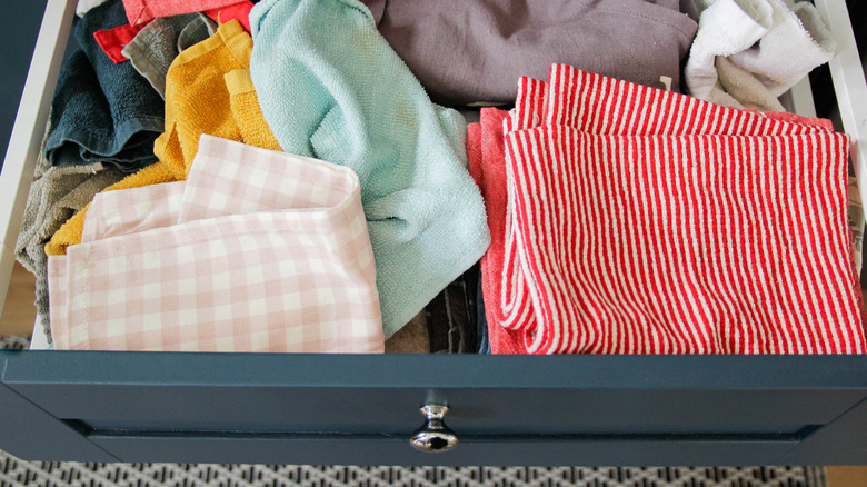 Cleaning towels in a messy mess in a kitchen drawer
