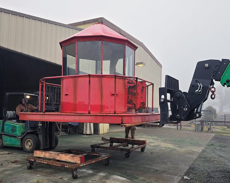 Yaquina Bay Lighthouse Lantern is raised by a forklift