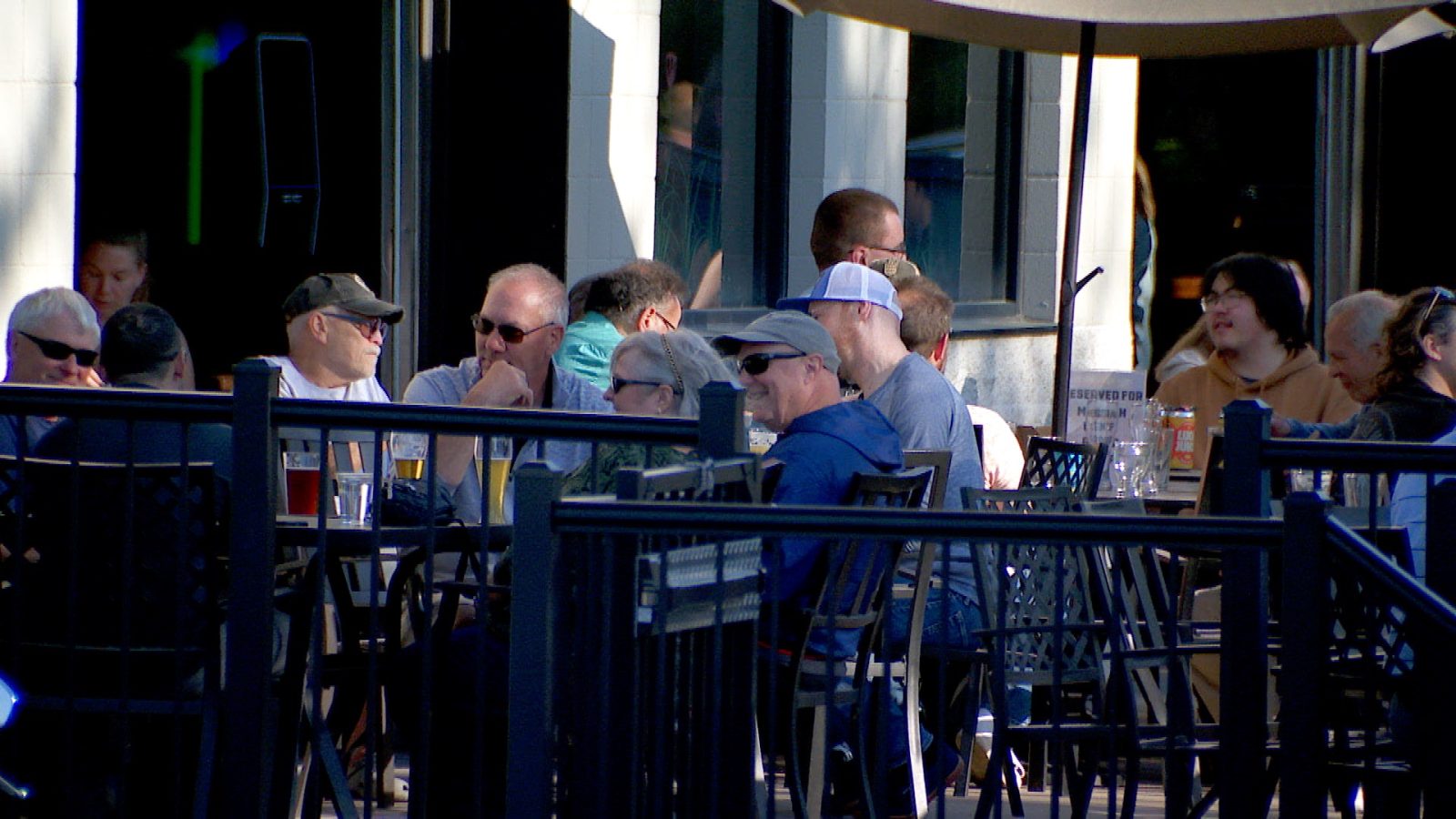 Scene of people who eat and drink on a restaurant terrace outside