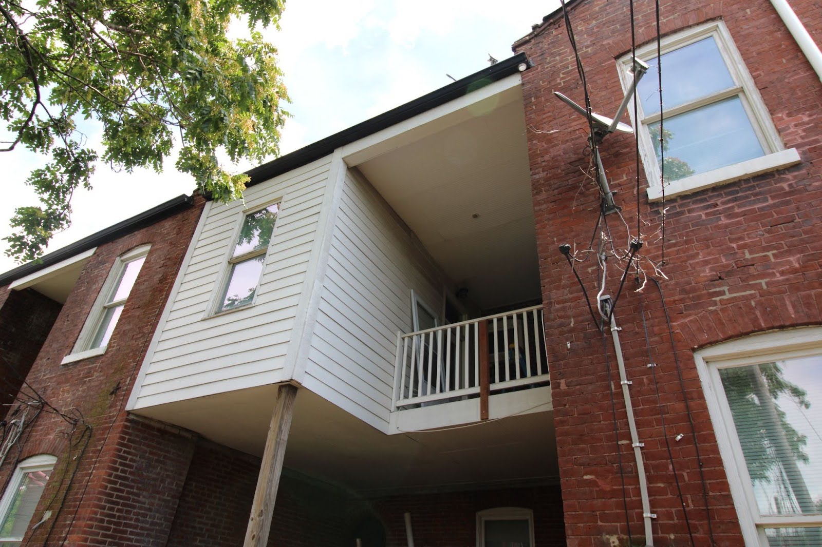 Review of Ms. Hudson's house, who has currently weathered and repaired in the back yard 