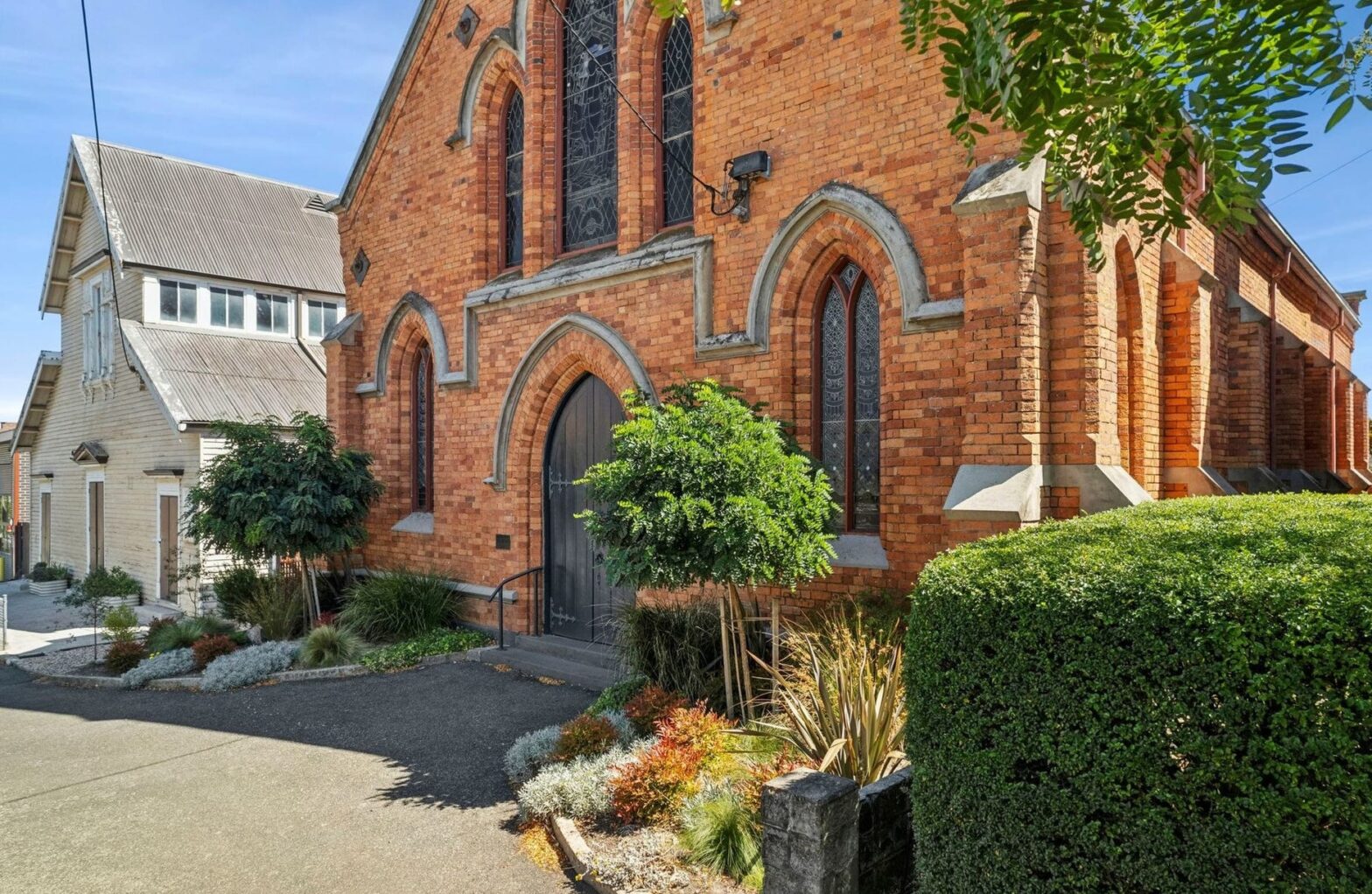 Divine pairing: converted church and school building listed side by side