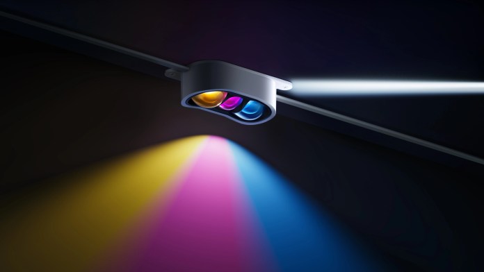 Close up of the constant prism of Govees of permanent outdoor lights with three light minds that project different colors against a dark background.