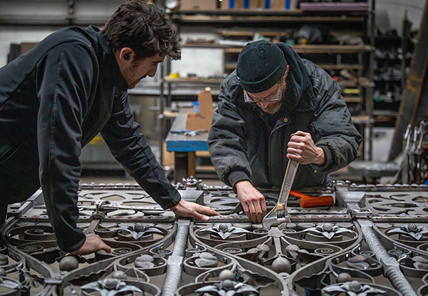 Two experts for Heritage Metal Restoration are putting together a goal in the Dominion Restization workshop.