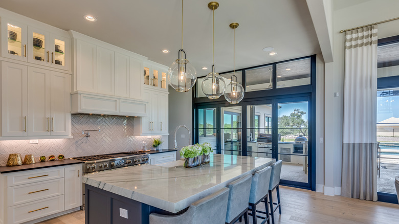 A kitchen is illuminated by under-cabinet, task and pendant lighting