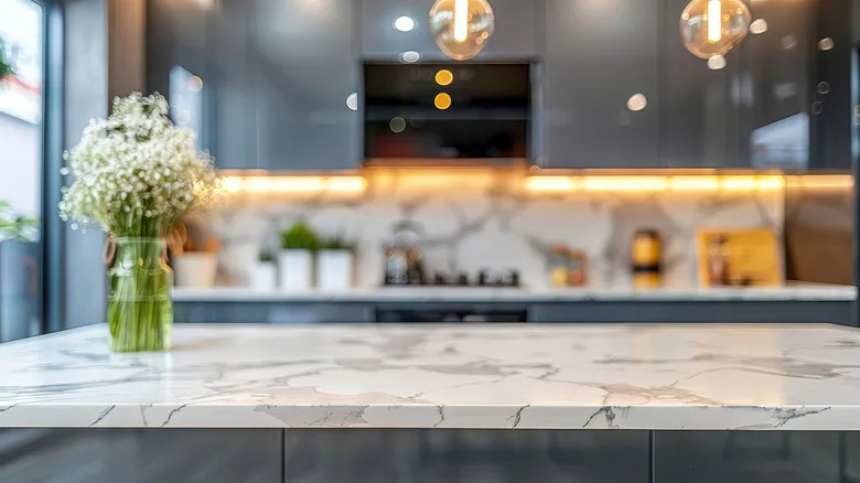 Veined marble kitchen countertop with flower vase