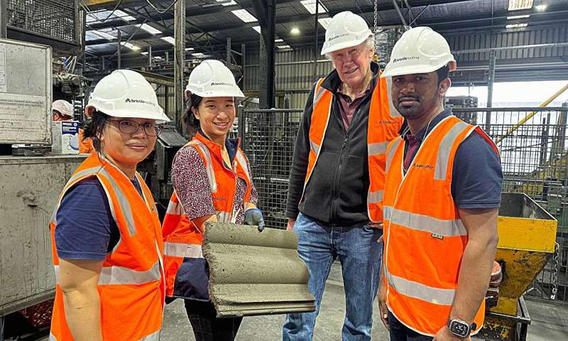 Yulin Patrisia from RMIT, Samantha So from Bristile Roofing, Dr. RMIT's David Law and student Madushan Mudiyanselage at the Bristile factory in Dandenong. Photo credit: RMIT University Low-CO2 roof tiles give industrial waste a new home