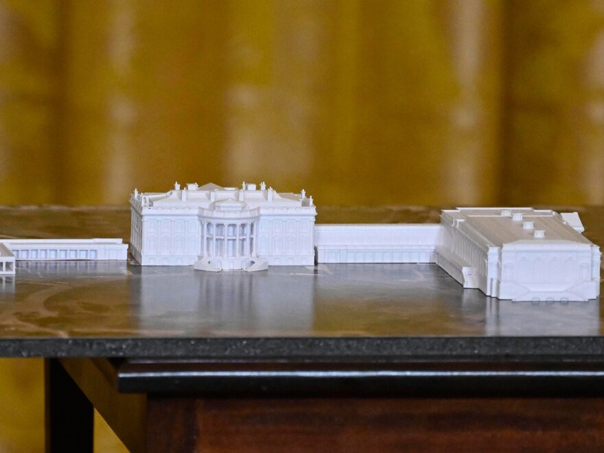 A model is seen as President Trump speaks at a dinner for donors who helped build the new White House Ballroom on October 15 in Washington, DC