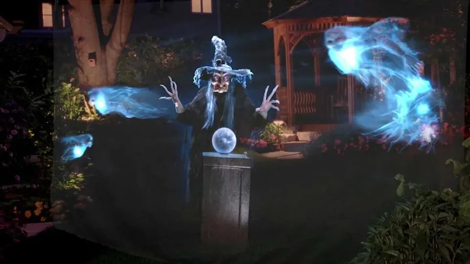 A witch projected onto a light piece of tulle fabric.