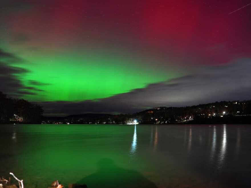 The Northern Lights brighten the sky over Putnam Lake in Patterson, NY on Tuesday.