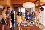 Linda Taalman (right) talks to visitors in the dining room, which leads to a large terrace overlooking the new pool.