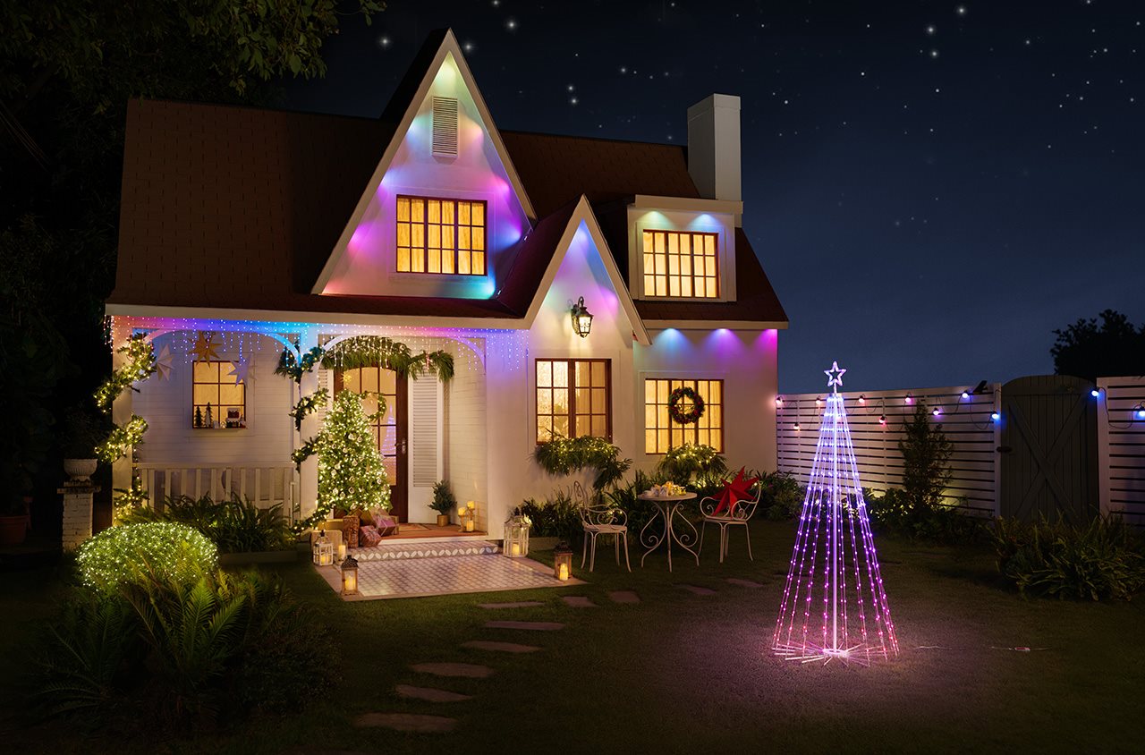Outdoor lighting on a house and outdoor tree made of lights.