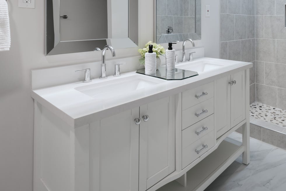 elegant owner's bathroom with double vanity and walk-in shower
