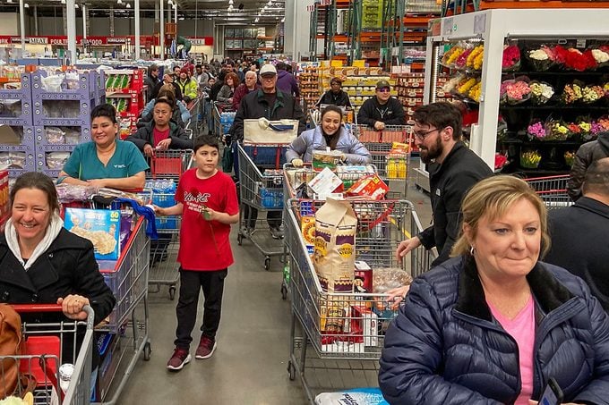 Shoppers flooded Costco, leading to a checkout line stretching to the back of the store as they restocked their household supplies