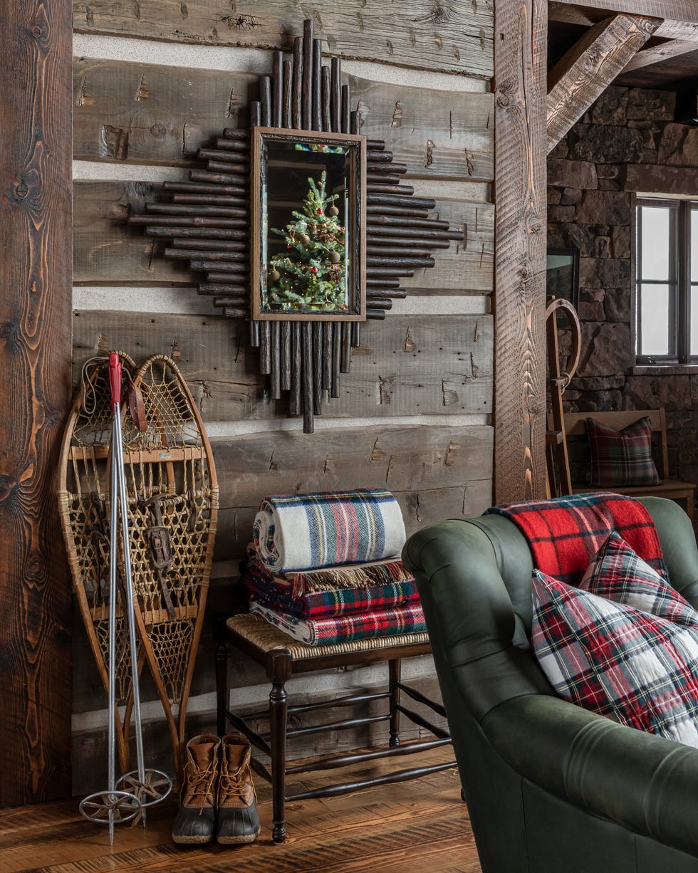 Snowshoes in a hallway at Christmas Rustic cabin with plaid blankets and snowshoes