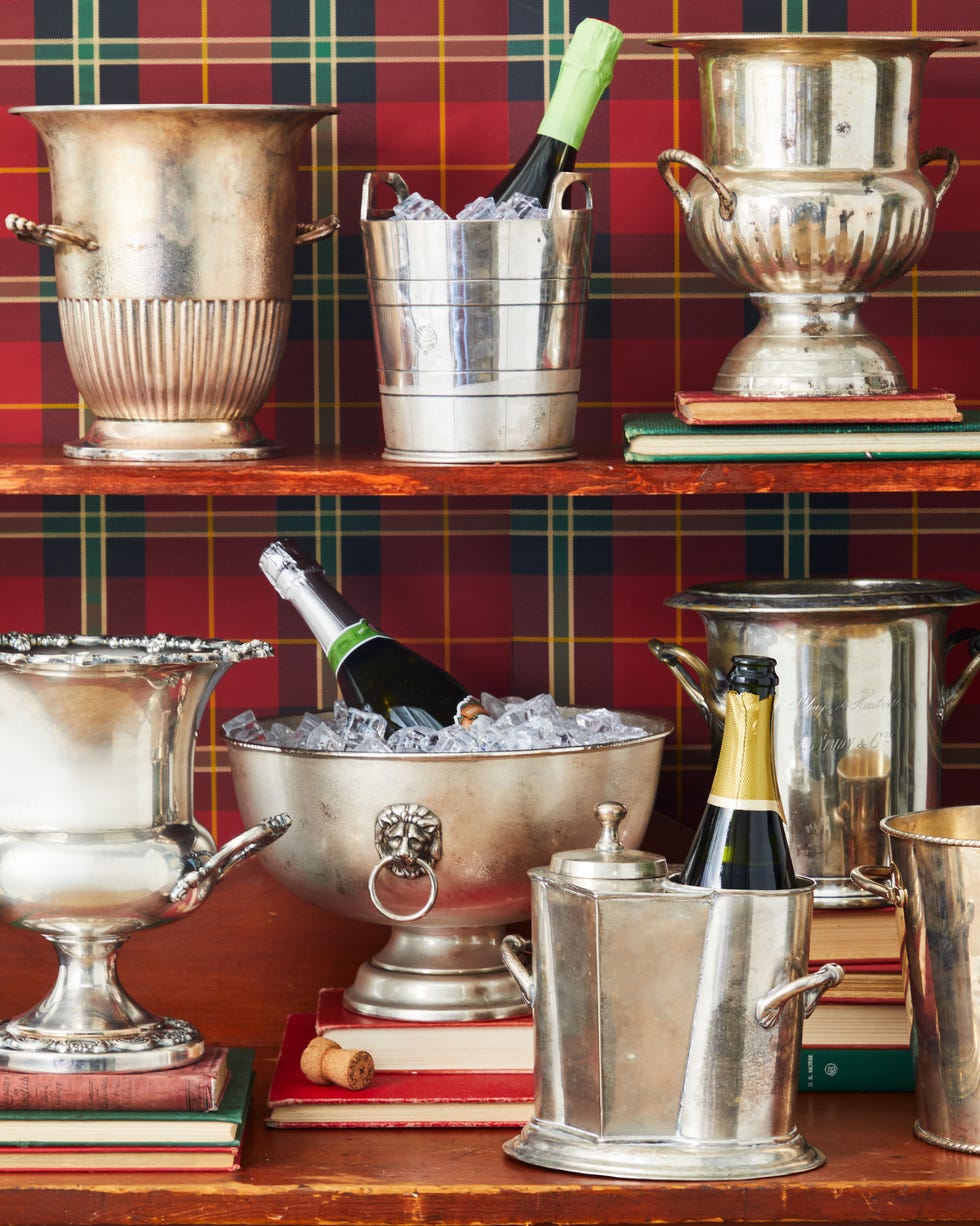 Silver ice buckets with champagne bottles Silver ice buckets with champagne bottles