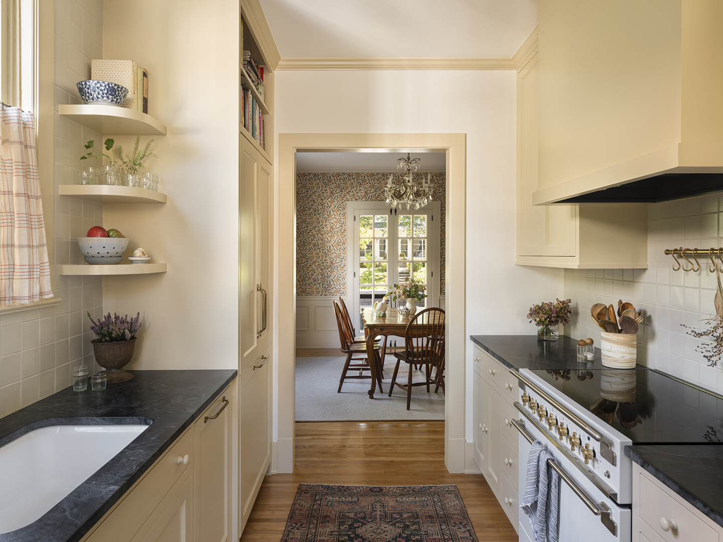 wide hallway in a kitchen leading to a dining room