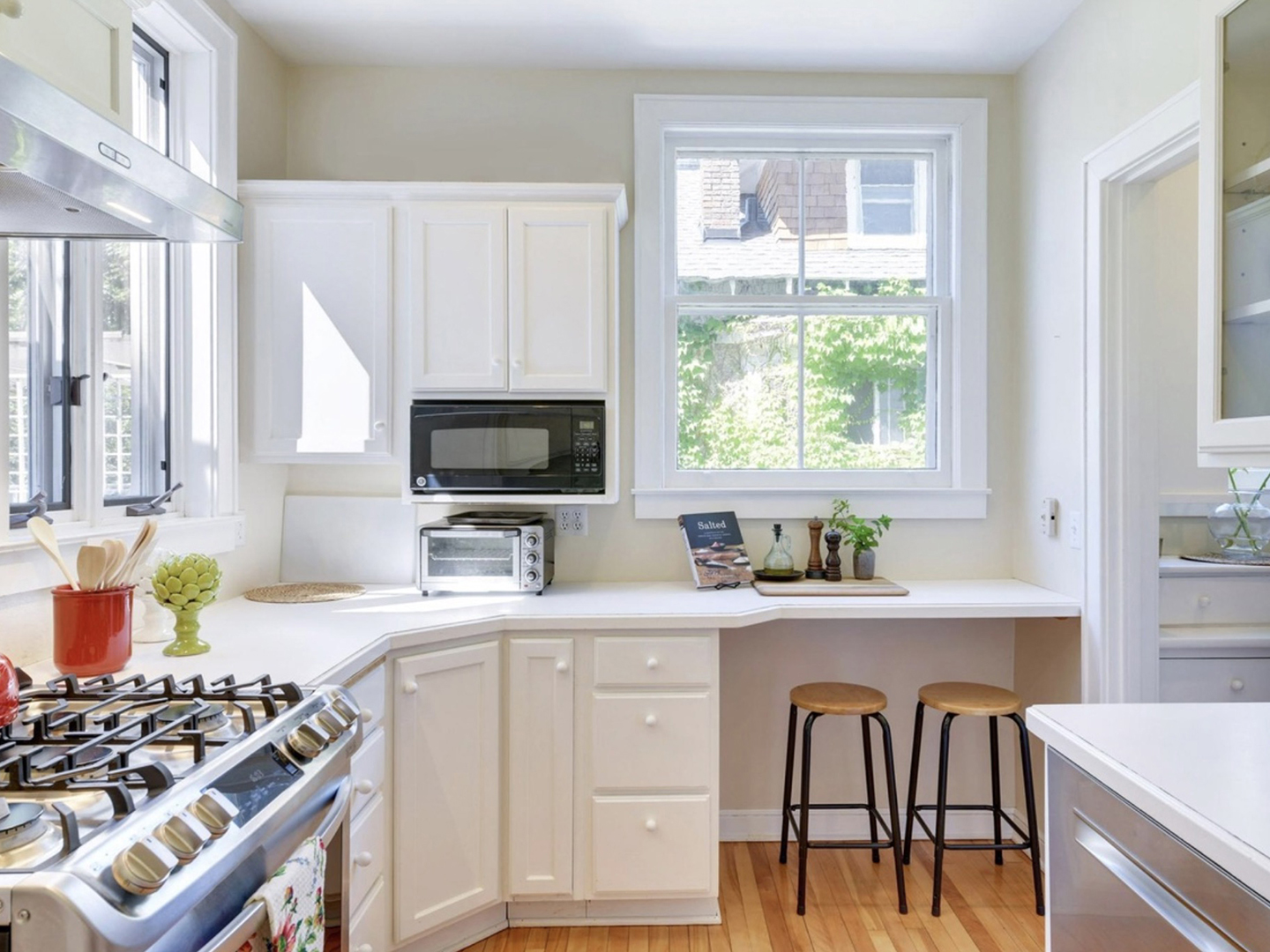 white kitchen with counter stools